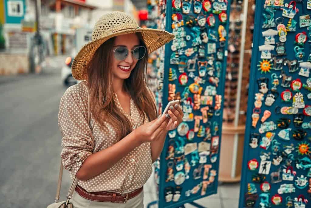 Shopper admiring pin at outdoor market