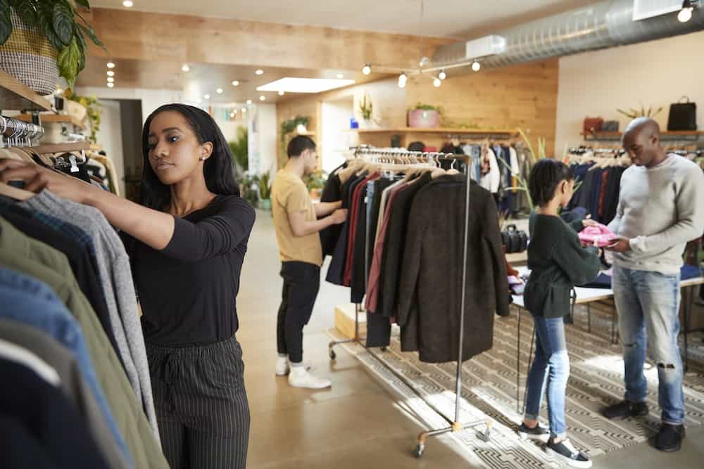 Shoppers shifting through clothing