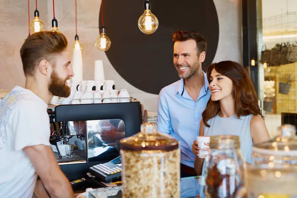 Barista receiving feedback from customers