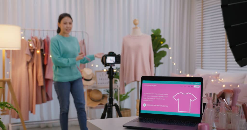 E-commerce retail employee films live video releasing new product