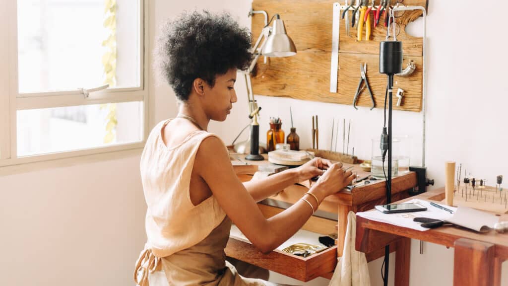 Woman working on ornament designing