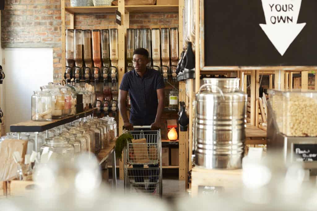 Local grocer store owner scoping out a competing grocery store