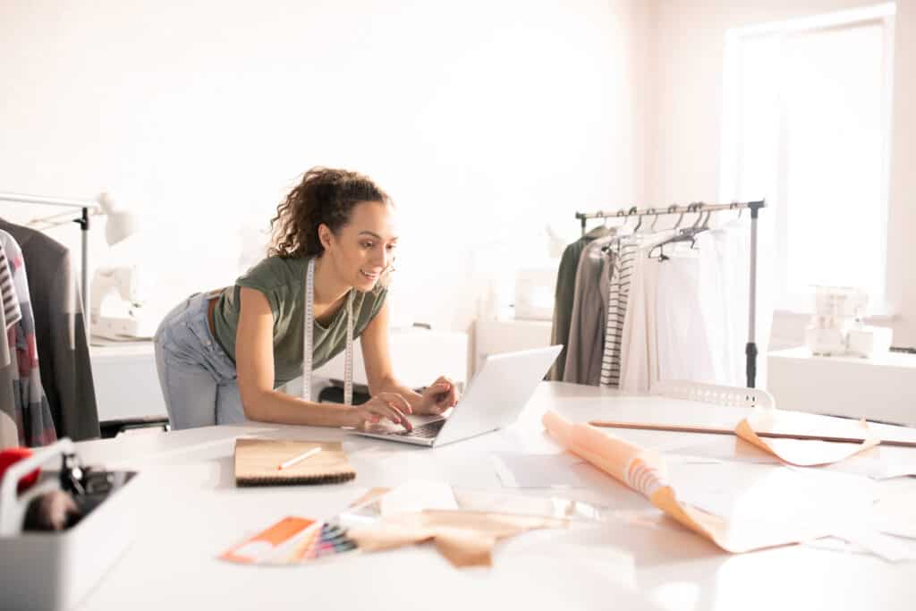 Designer looking through profit analytics from her different sales channels.